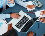 Accounting - Business people calculating budget in meeting