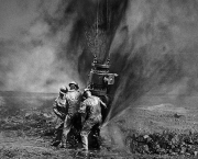 Salgado Workers Three Workers Capping a Wellhead Burhan Oil Field, Kuwait 1991